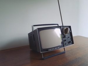 watching television on enormous televisions