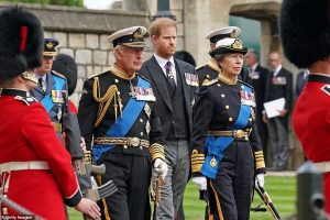 Harry did not wear a military uniform for the burial; instead, he wore a suit