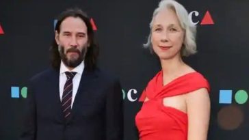 During Their Rare Red Carpet Appearance Together, Keanu Reeves & Girlfriend, Alexandra Grant, Hold Hands
