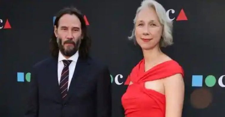 During Their Rare Red Carpet Appearance Together, Keanu Reeves & Girlfriend, Alexandra Grant, Hold Hands